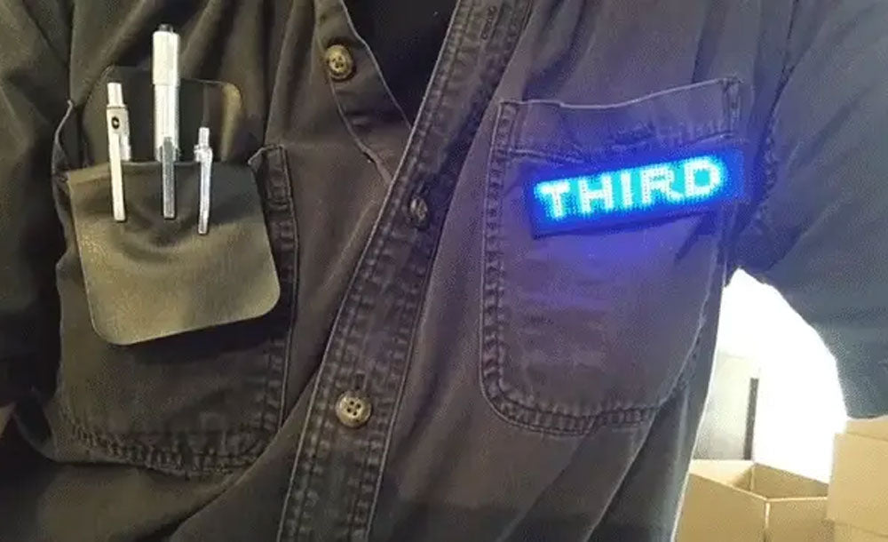 Image of the flashy Third Wave Water badges used to get attention at events