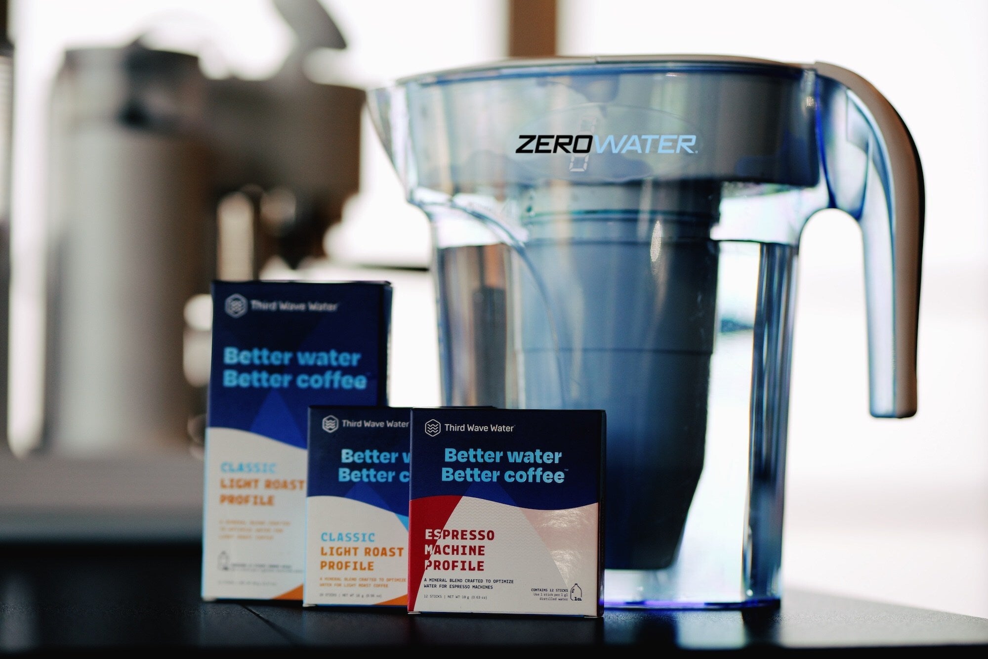 Three Third Wave Water boxes with a ZeroWater water filter pitcher