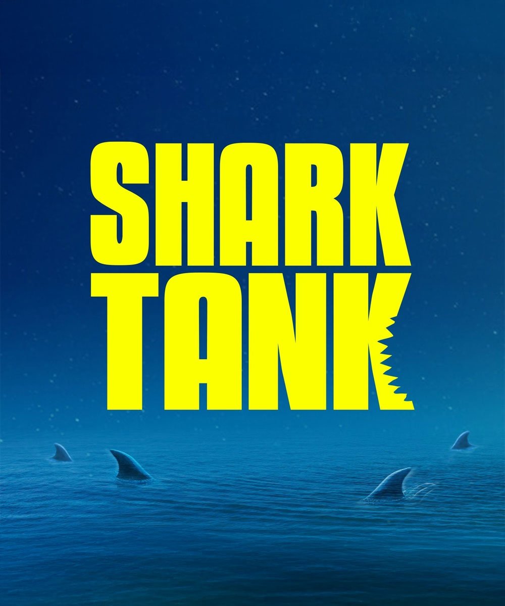 Shark Tank logo with yellow text on a blue ocean background